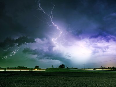 Tornado Alley Severe Storm at Night Time. Severe Lightnings Above Farmlands in Illinois, USA. Severe Weather Photography Collection.